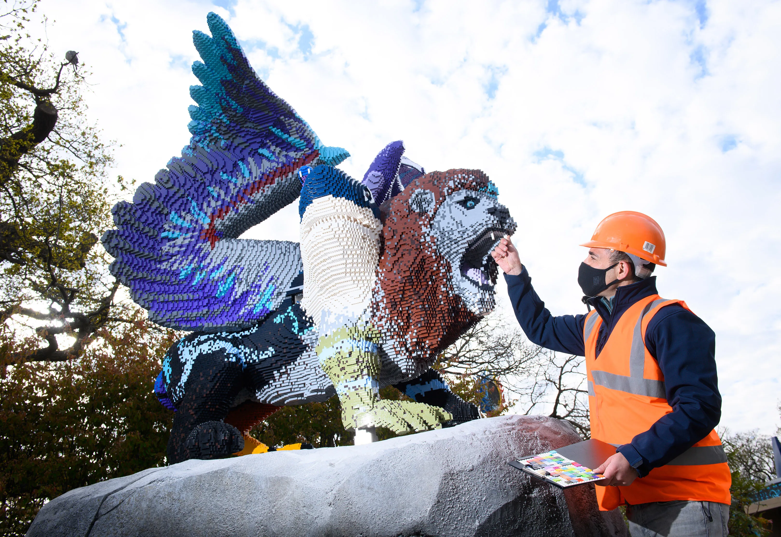 Adding finishing touches to Chimera LEGO Model in LEGO MYTHICA at the LEGOLAND Windsor Resort
